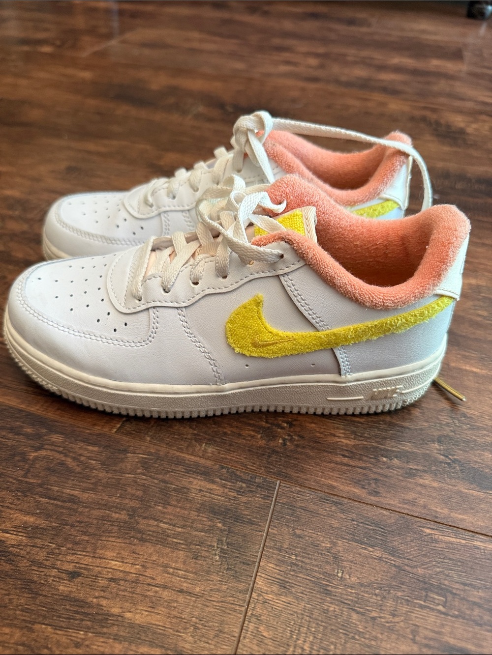 Nike Kids White Leather Sneakers with Yellow Swoosh and Peach Lining